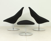 A PAIR OF GLOBE CHAIRS AND OTTOMAN BY PIERRE PAULIN