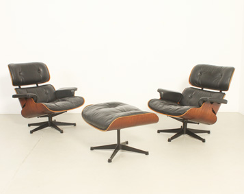 PAIR OF LOUNGE CHAIRS AND OTTOMAN BY CHARLES AND RAY EAMES